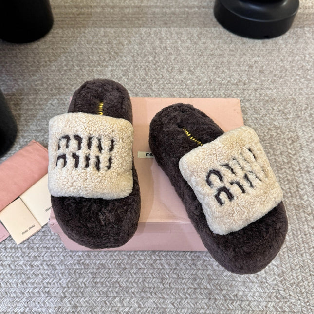 MIUMIU 26S PLATFORM SLIDES IN DARK BROWN AND BEIGE SHEARLING