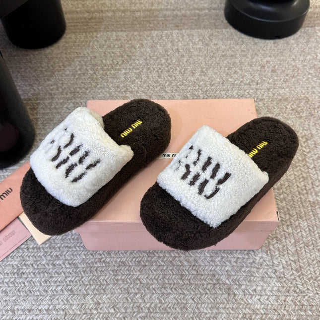 MIUMIU 26S PLATFORM SLIDES IN DARK BROWN AND WHITE SHEARLING