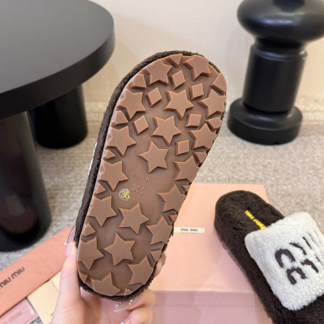 MIUMIU 26S PLATFORM SLIDES IN DARK BROWN AND WHITE SHEARLING