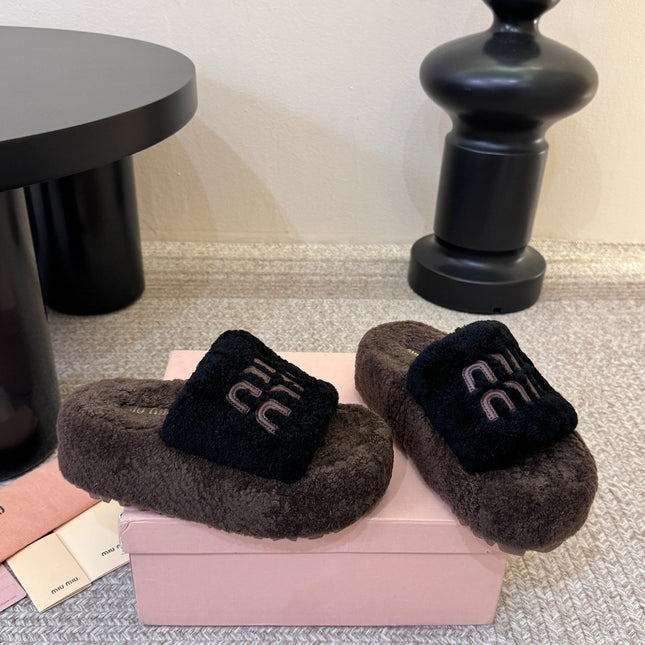 MIUMIU 26S PLATFORM SLIDES IN DARK BROWN AND BLACK SHEARLING