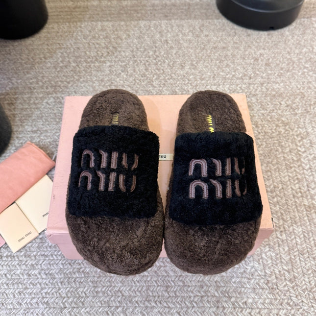 MIUMIU 26S PLATFORM SLIDES IN DARK BROWN AND BLACK SHEARLING