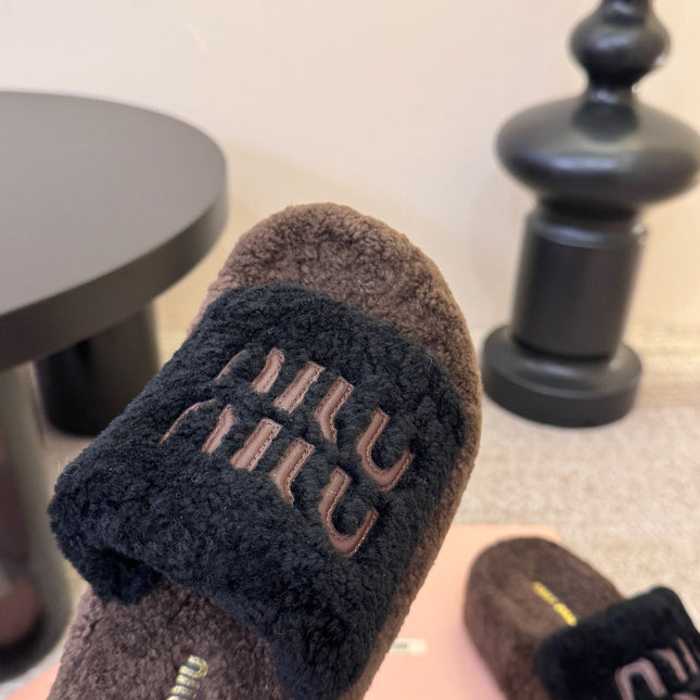MIUMIU 26S PLATFORM SLIDES IN DARK BROWN AND BLACK SHEARLING