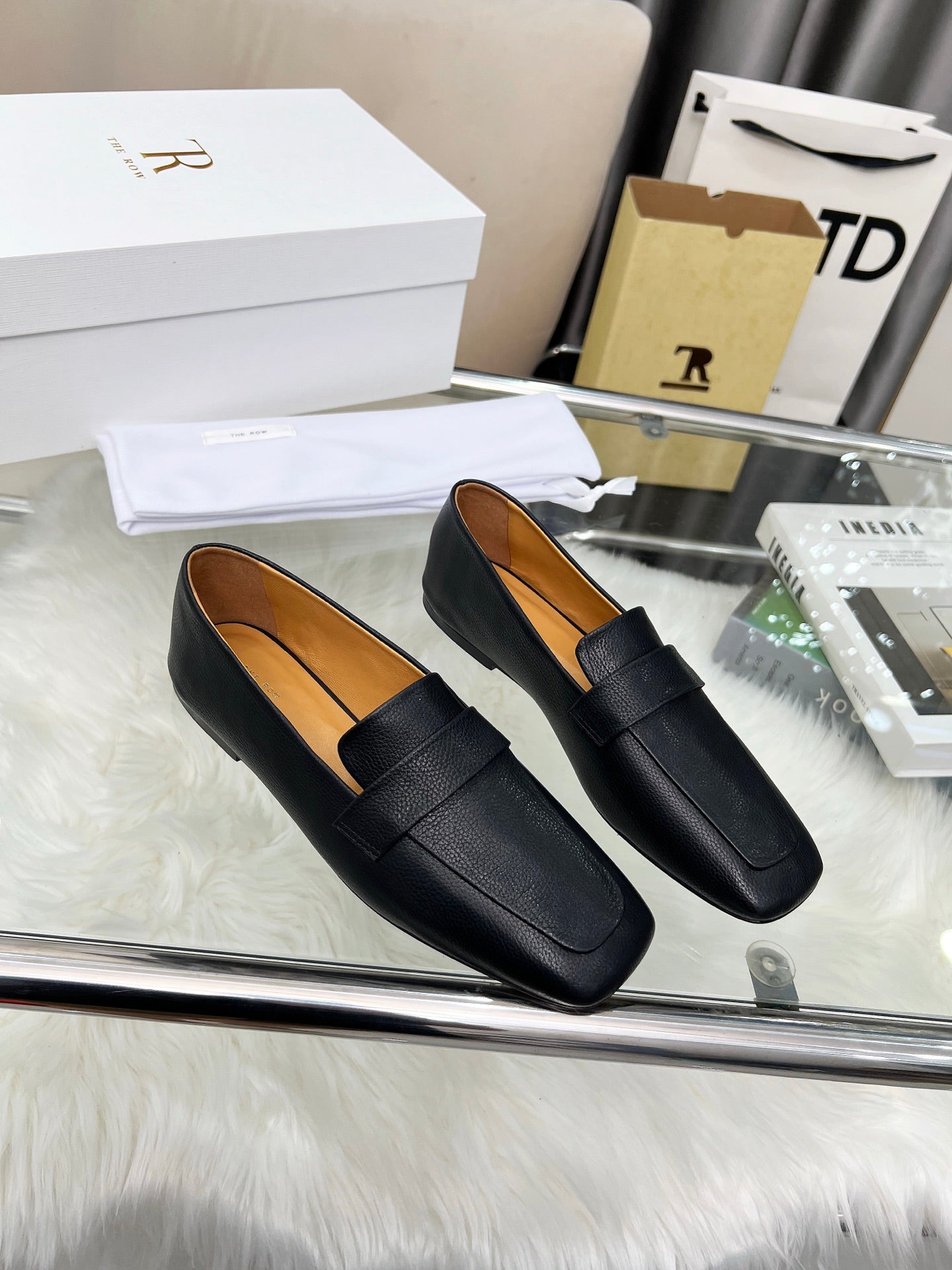 THE ROW 26S PENNY LOAFER FLATS IN BLACK GRAINED CALFSKIN