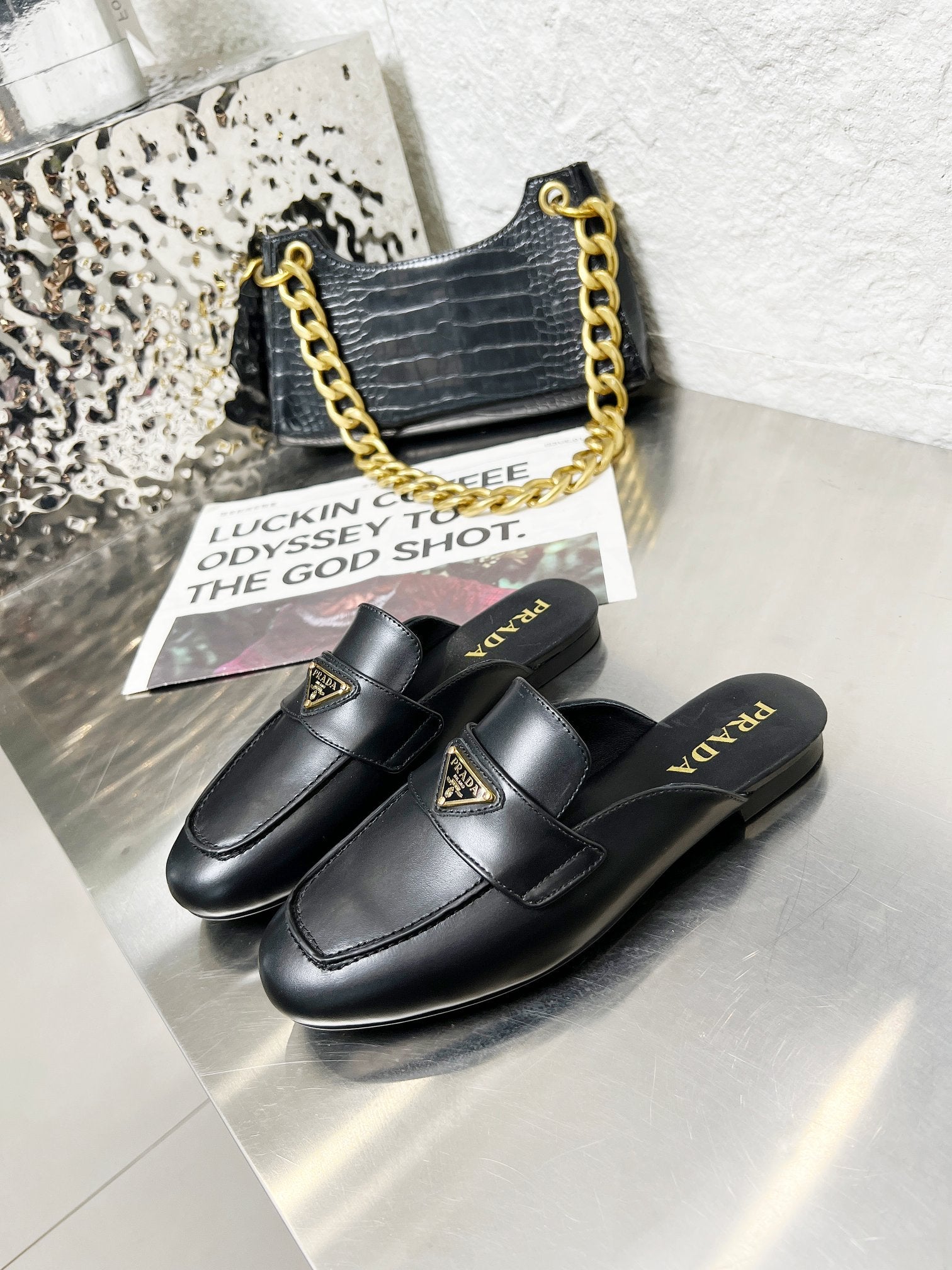 PRADA 26S MULE LOAFERS IN BLACK CALFSKIN WITH LOGO