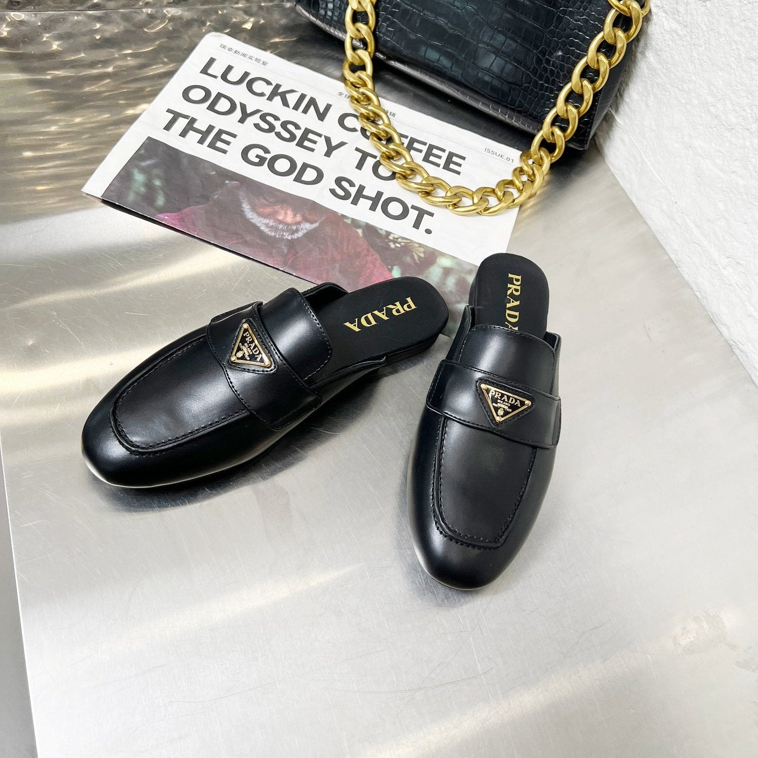 PRADA 26S MULE LOAFERS IN BLACK CALFSKIN WITH LOGO
