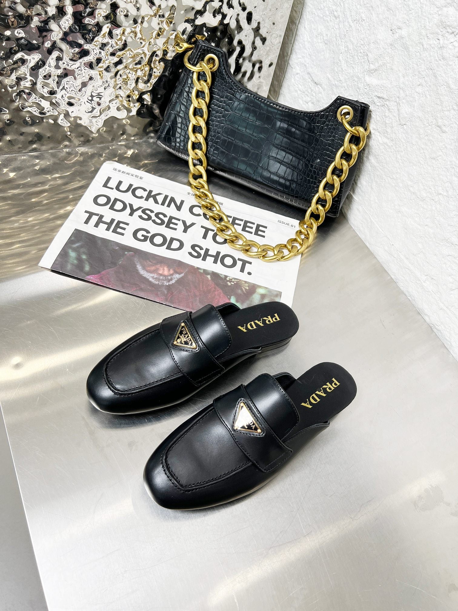 PRADA 26S MULE LOAFERS IN BLACK CALFSKIN WITH LOGO