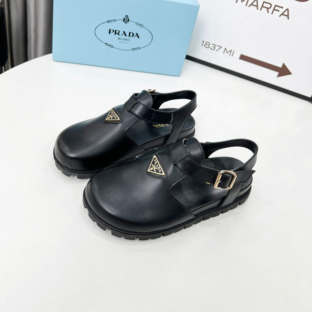 PRADA 26S RUBBER LOGO CHUNKY SOLE FISHERMAN SANDALS IN BLACK CALFSKIN
