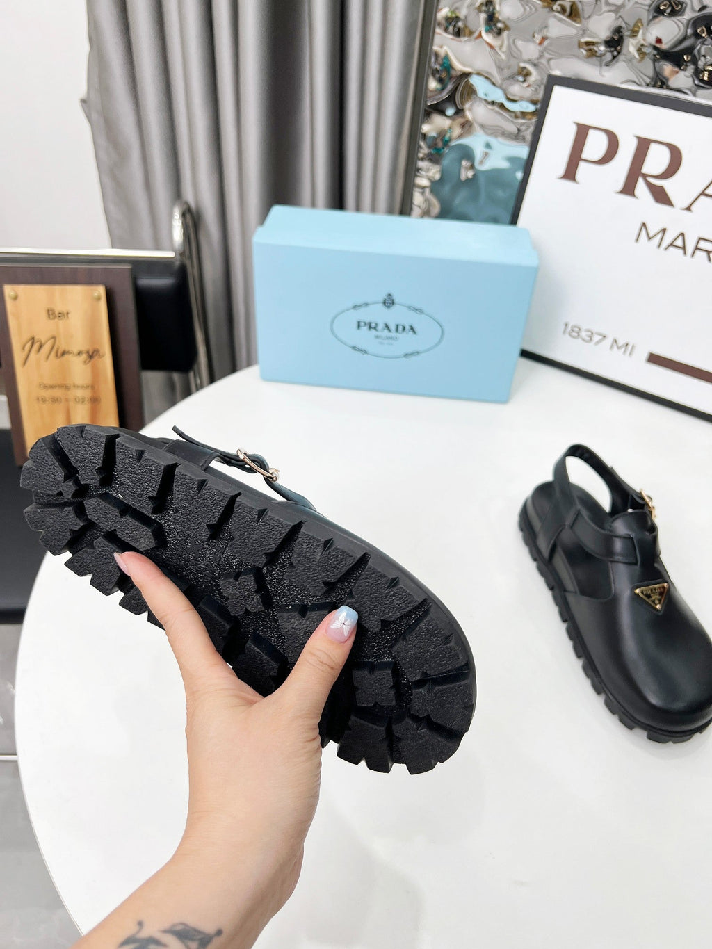 PRADA 26S RUBBER LOGO CHUNKY SOLE FISHERMAN SANDALS IN BLACK CALFSKIN