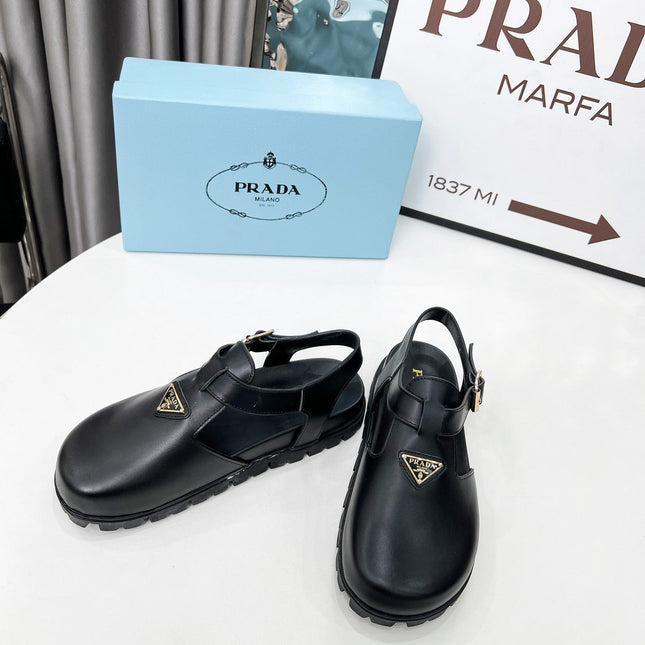 PRADA 26S RUBBER LOGO CHUNKY SOLE FISHERMAN SANDALS IN BLACK CALFSKIN