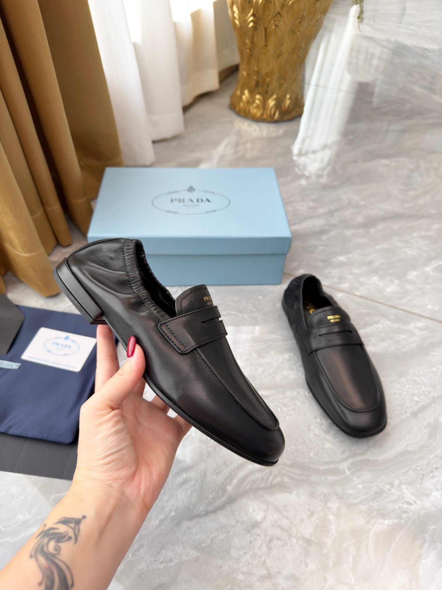 PRADA 25S LOAFERS IN BLACK CALFSKIN