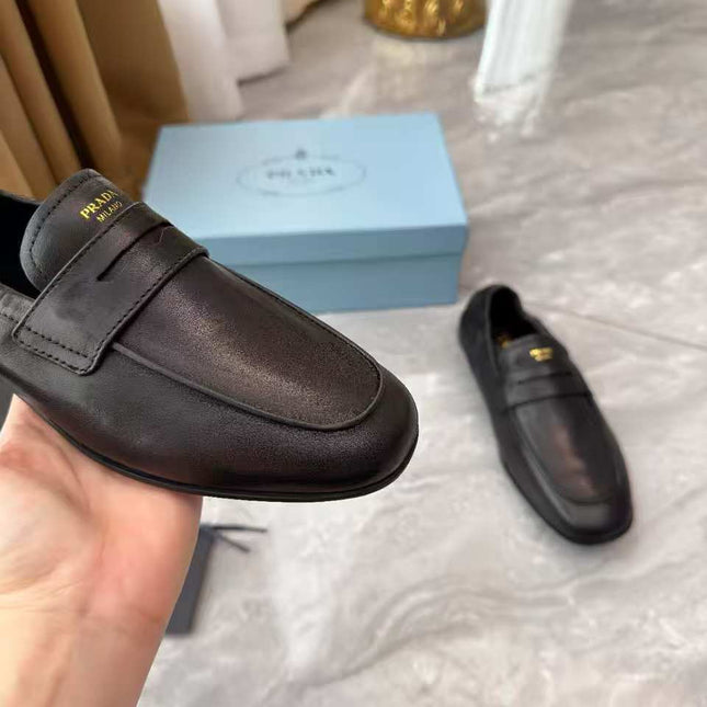 PRADA 25S LOAFERS IN BLACK CALFSKIN