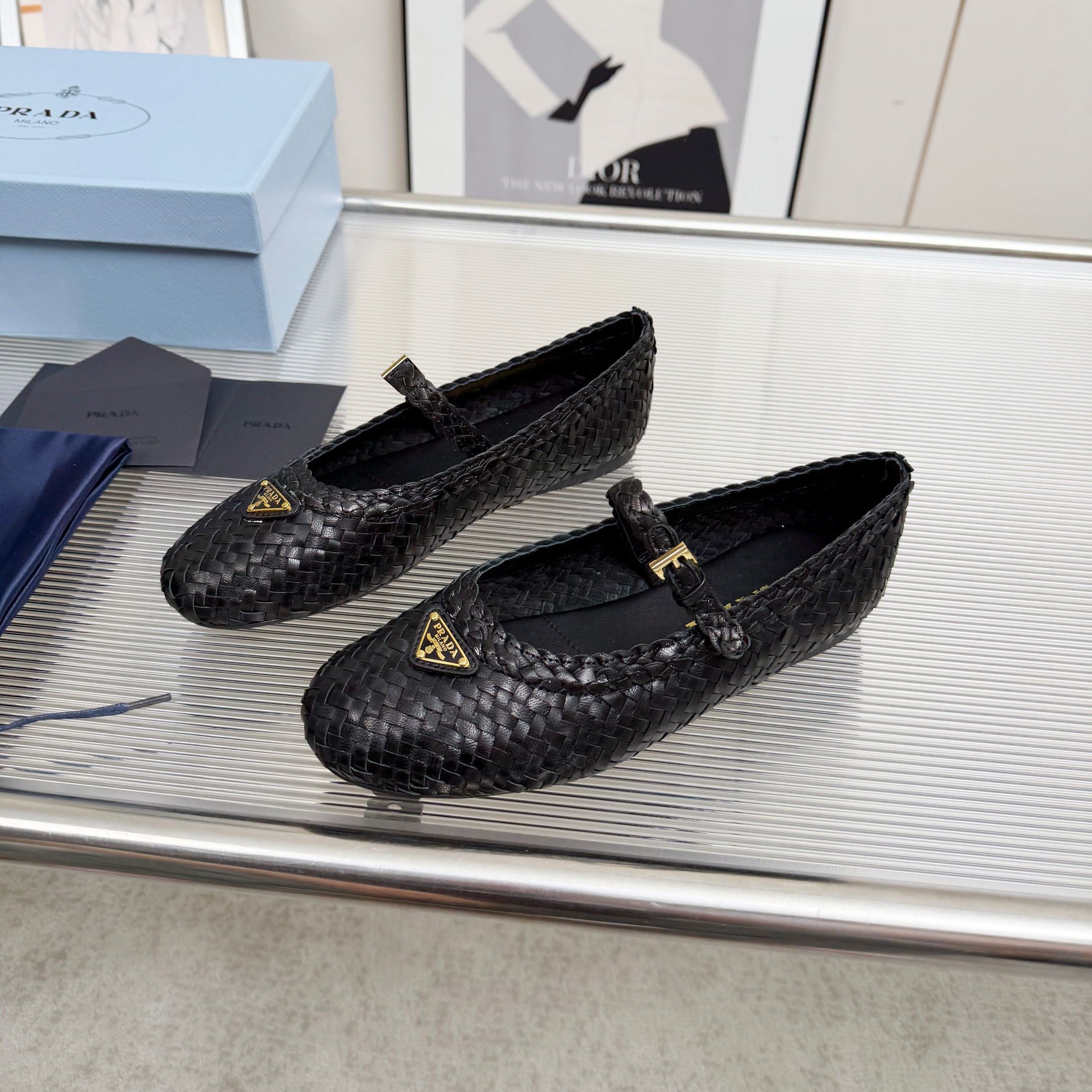 PRADA 26S MARY JANE FLATS IN BLACK WOVEN CALFSKIN