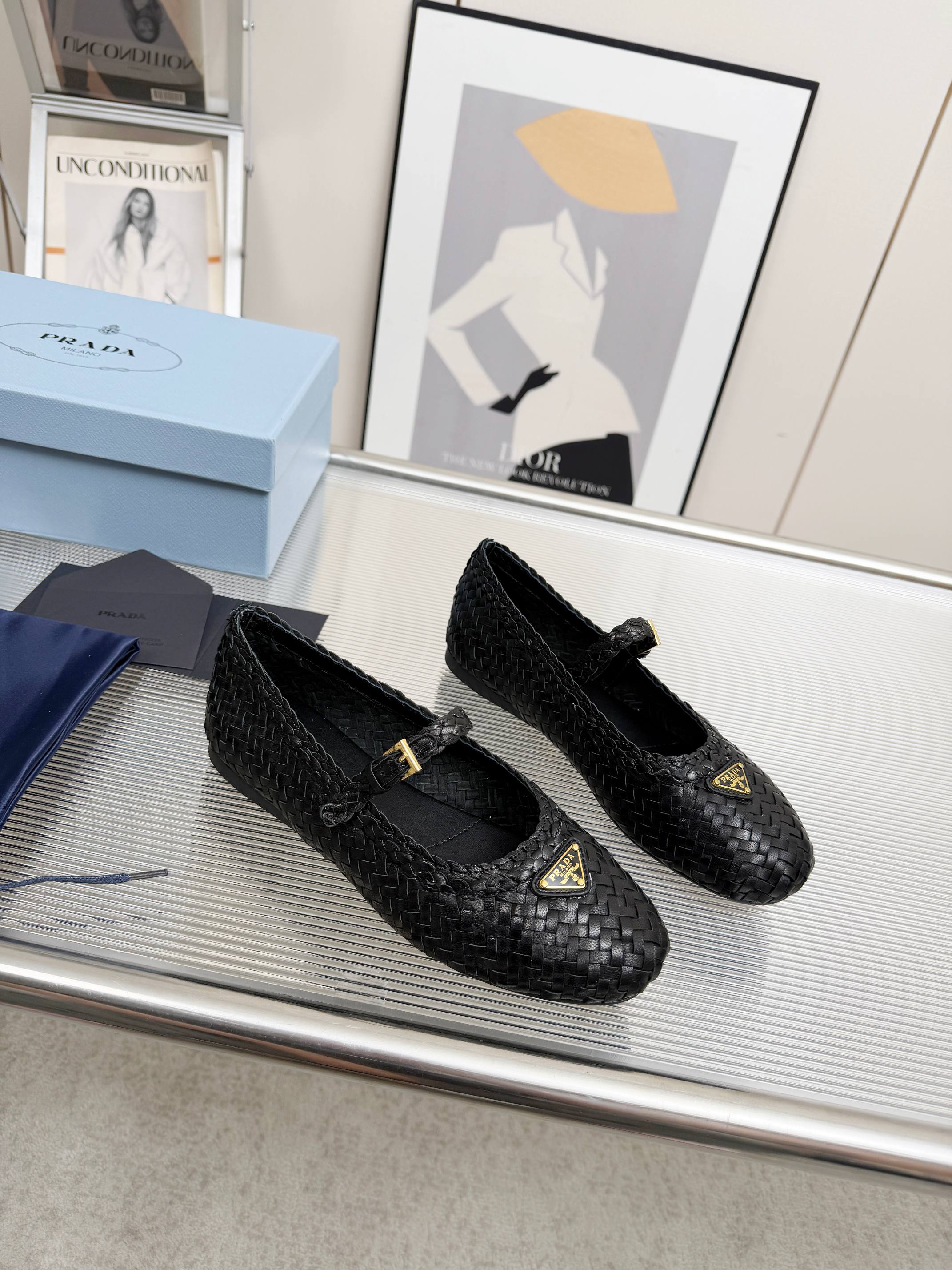 PRADA 26S MARY JANE FLATS IN BLACK WOVEN CALFSKIN