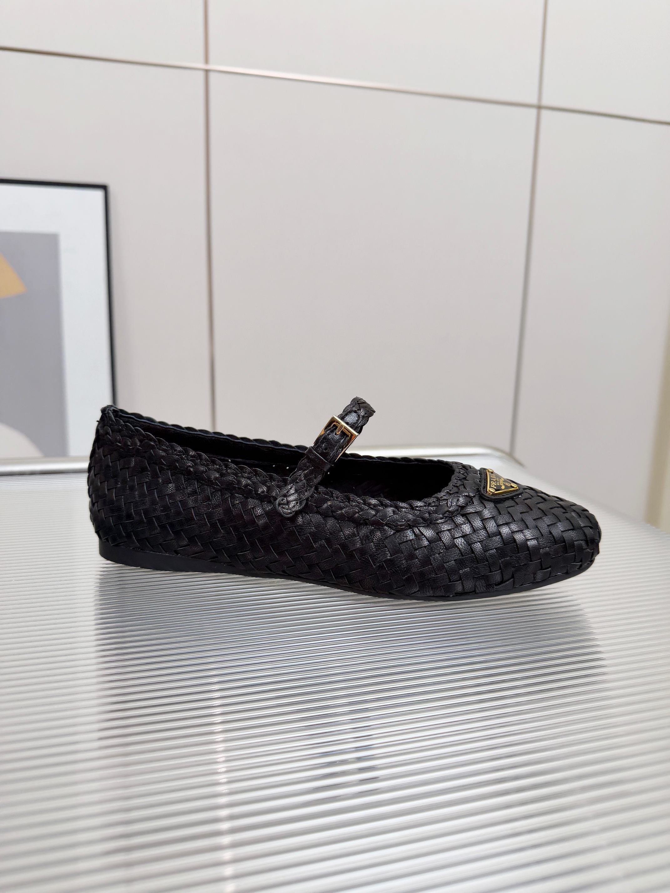 PRADA 26S MARY JANE FLATS IN BLACK WOVEN CALFSKIN