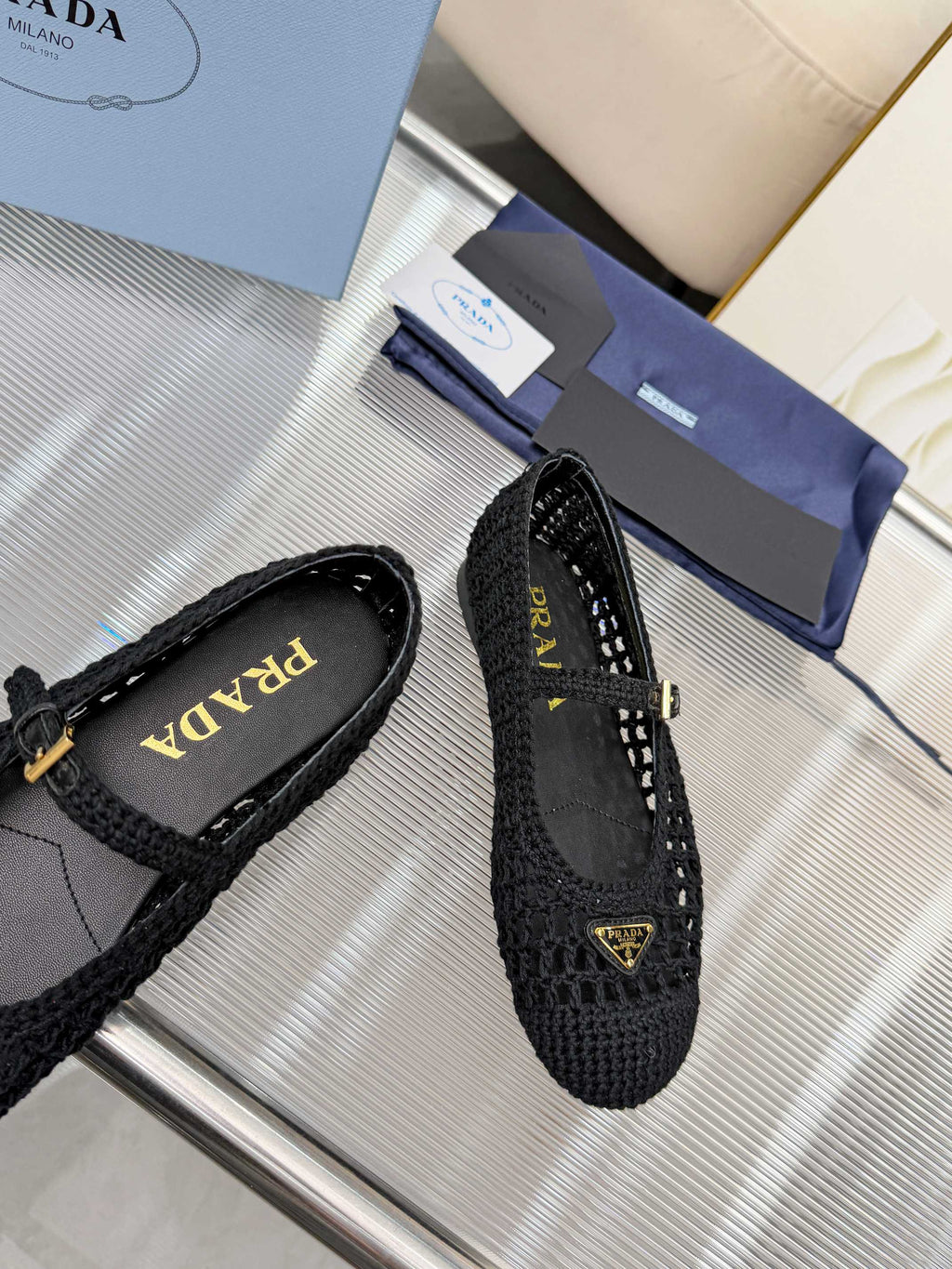 PRADA 26S MARY JANE FLATS IN BLACK WOVEN RAFFIA WITH TRIANGLE LOGO