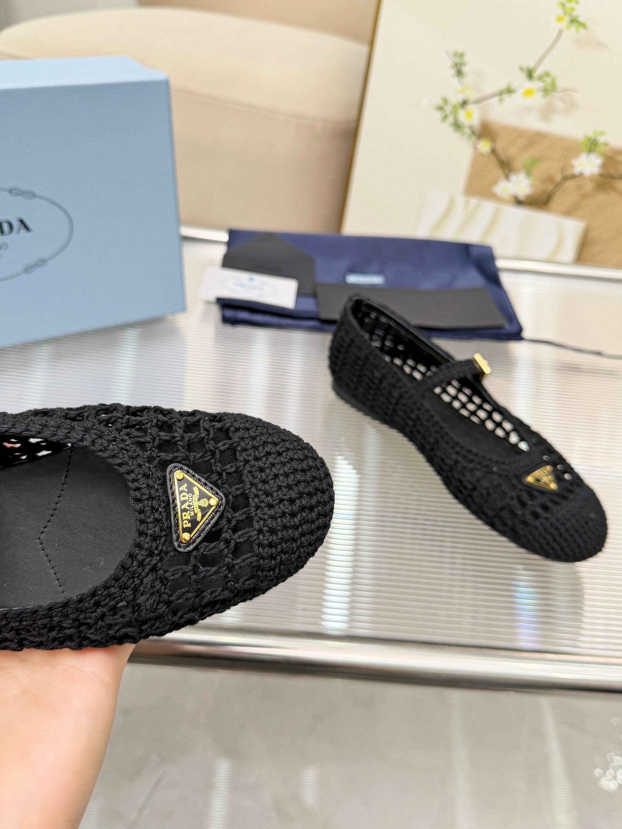 PRADA 26S MARY JANE FLATS IN BLACK WOVEN RAFFIA WITH TRIANGLE LOGO