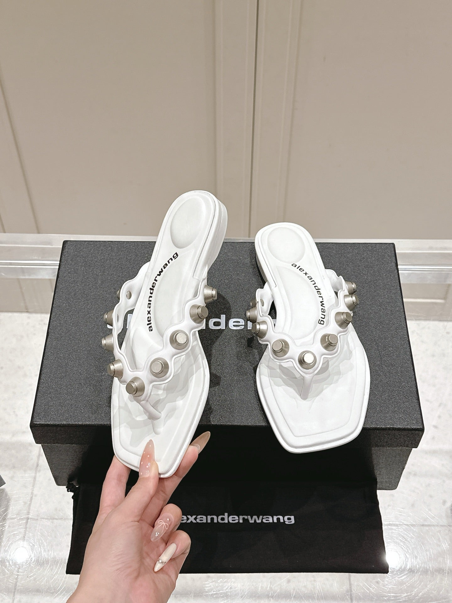 RHODES STUDDED THONG SANDALS IN WHITE CALFSKIN
