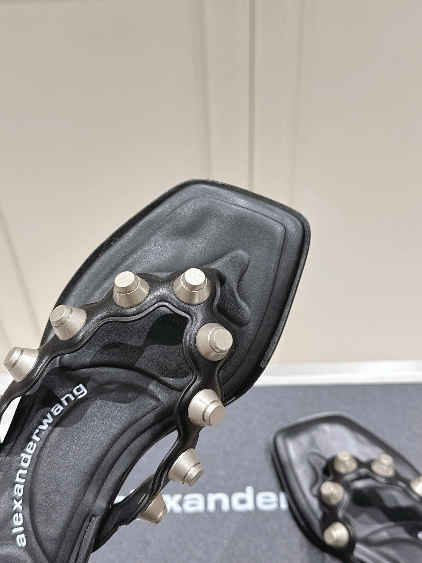 RHODES STUDDED THONG SANDALS IN BLACK CALFSKIN
