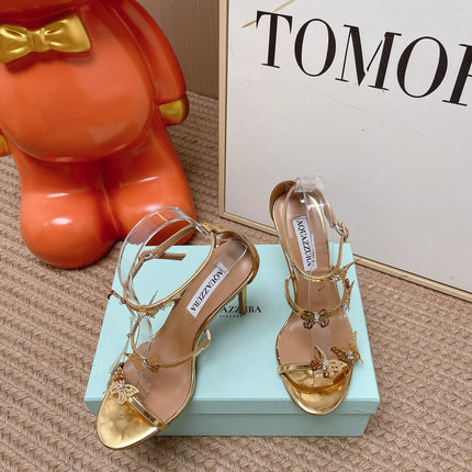 AQUAZZURA 26S BUTTERFLY HEELED SANDALS 100 MM IN GOLD CALFSKIN