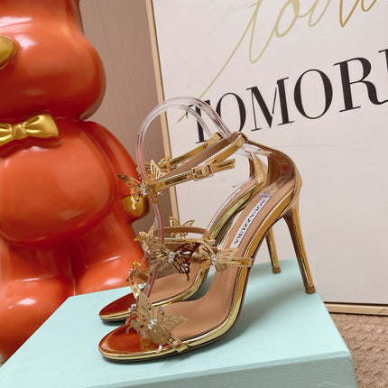 AQUAZZURA 26S BUTTERFLY HEELED SANDALS 100 MM IN GOLD CALFSKIN