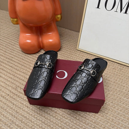 GUCCI 26S FLAT MULES IN BLACK GG EMBOSSED LAMBSKIN