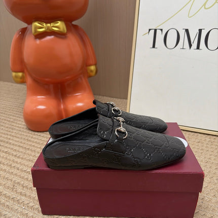 GUCCI 26S FLAT MULES IN BLACK GG EMBOSSED LAMBSKIN