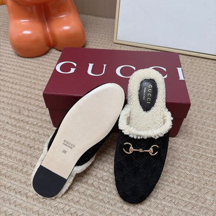 GUCCI 26S SHEARLING-LINED MULES IN BLACK SUEDE
