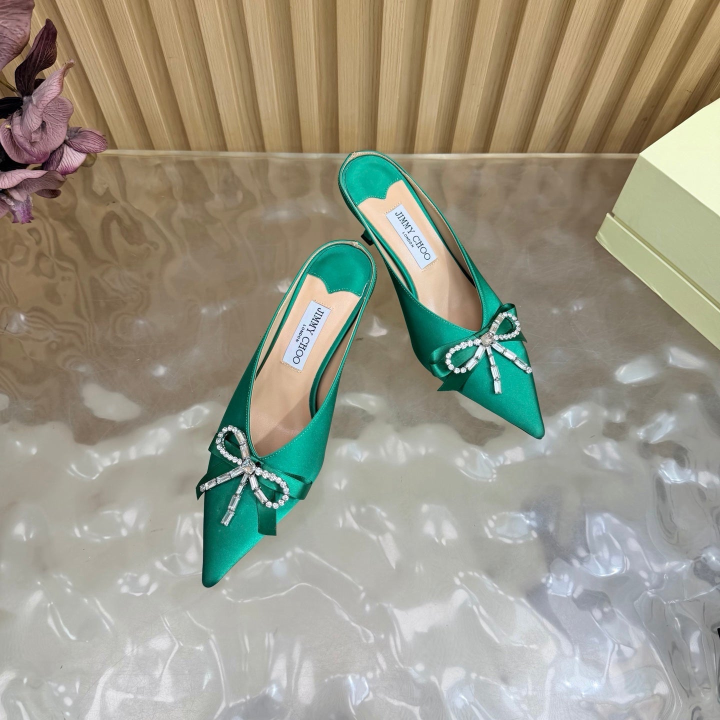 JIMMY CHOO 26S HIGH-HEELED MULES 65 MM IN GREEN SATIN WITH RHINESTONE BOW