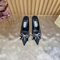 JIMMY CHOO 26S HIGH-HEELED MULES 65 MM IN BLACK SATIN WITH RHINESTONE BOW