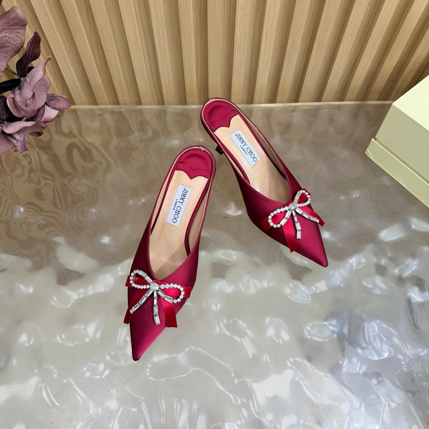 JIMMY CHOO 26S HIGH-HEELED MULES 65 MM IN RED SATIN WITH RHINESTONE BOW