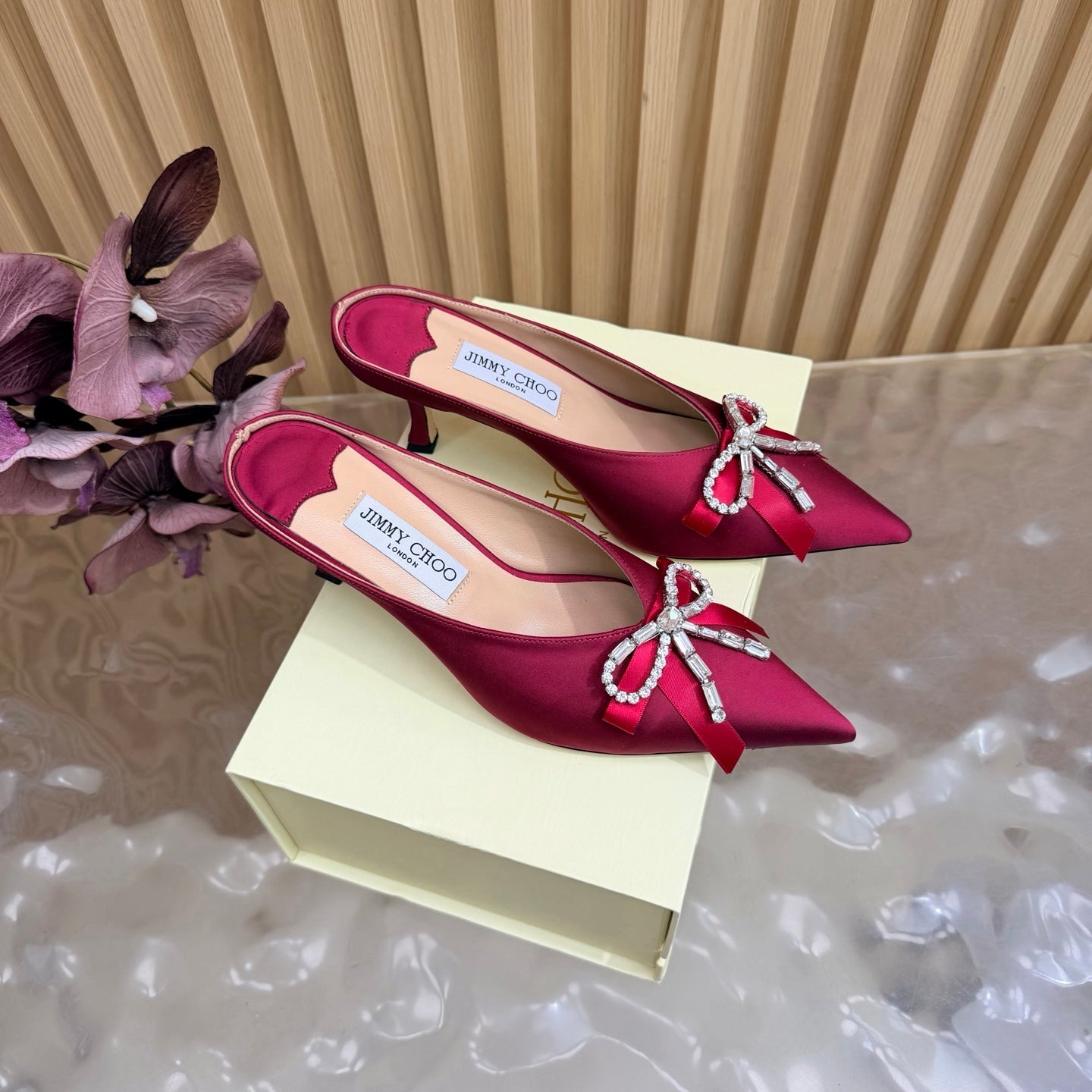 JIMMY CHOO 26S HIGH-HEELED MULES 65 MM IN RED SATIN WITH RHINESTONE BOW