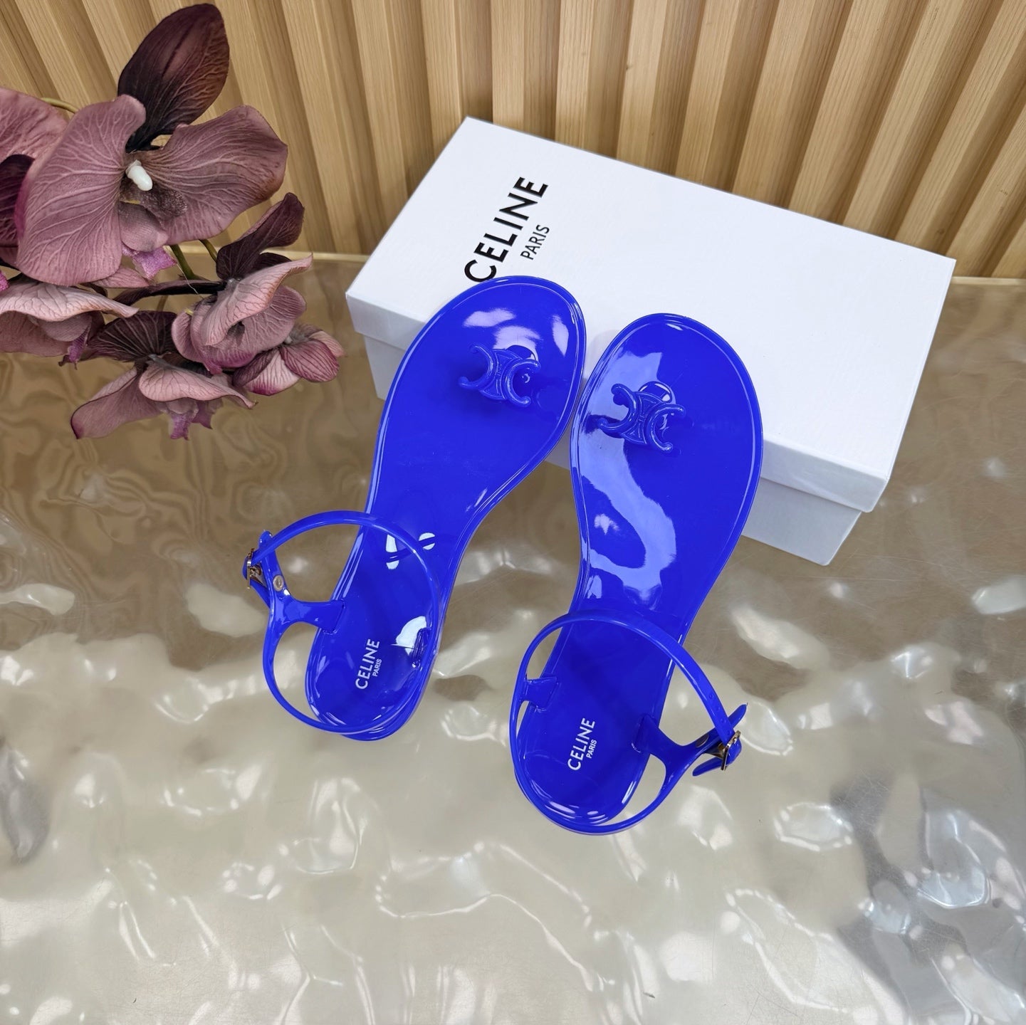 CELINE 26S TRIOMPHE JELLY THONG SANDALS IN DARK BLUE TPU GOLD HARDWARE