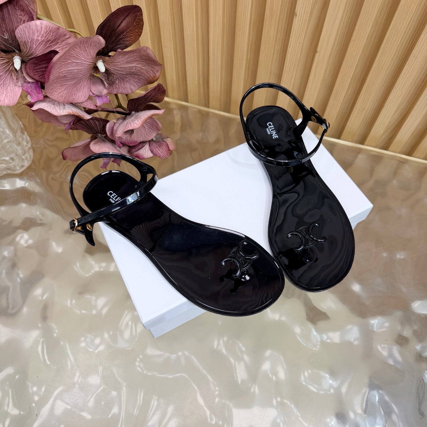 CELINE 26S TRIOMPHE JELLY THONG SANDALS IN BLACK TPU GOLD HARDWARE