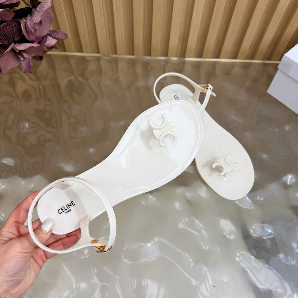 CELINE 26S TRIOMPHE JELLY THONG SANDALS IN WHITE TPU GOLD HARDWARE