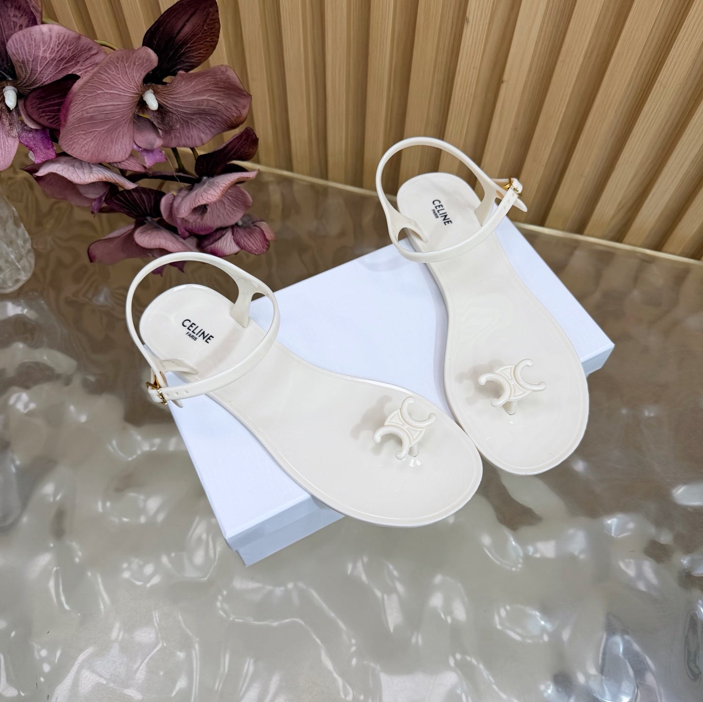 CELINE 26S TRIOMPHE JELLY THONG SANDALS IN WHITE TPU GOLD HARDWARE