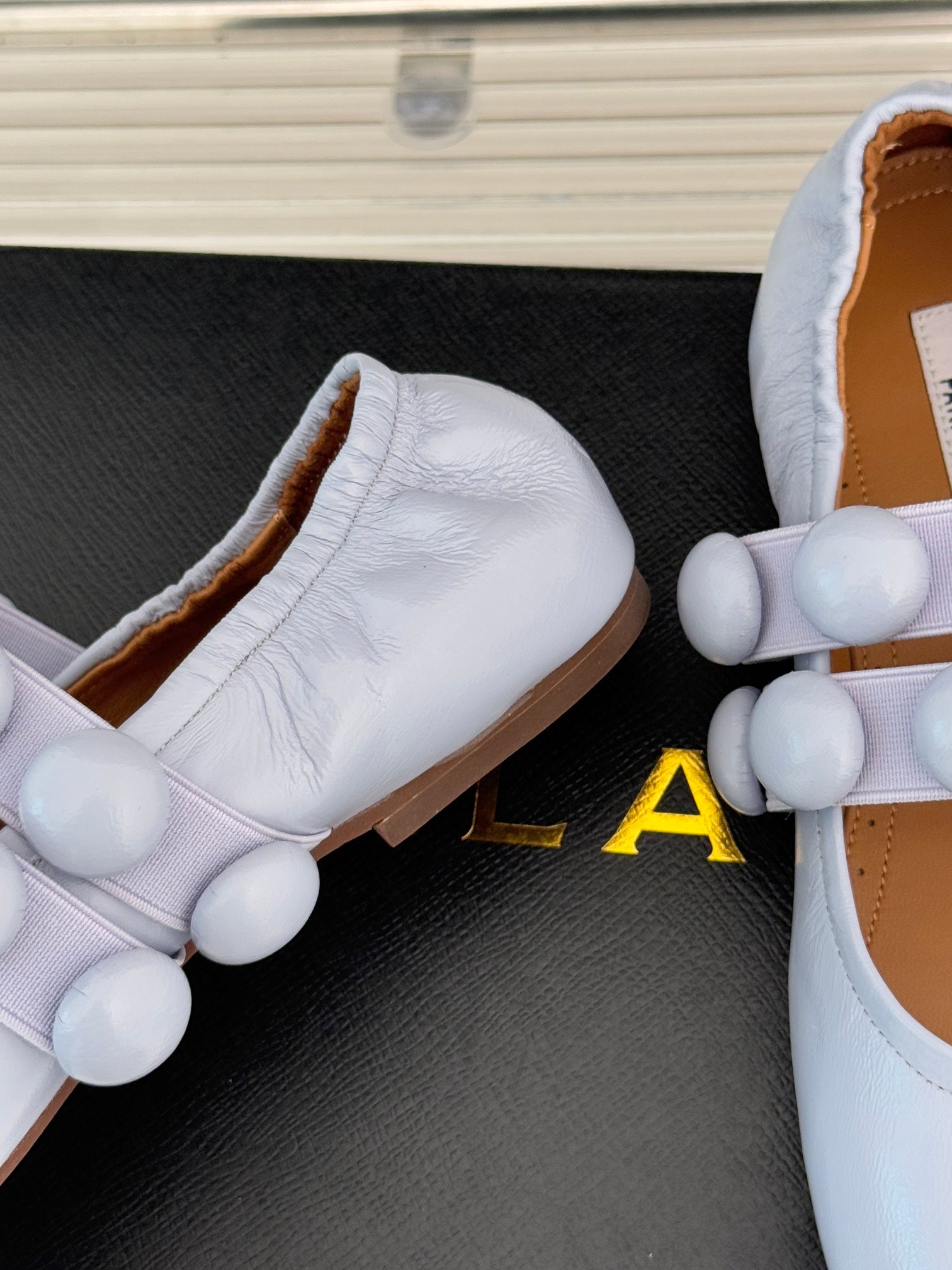 ALAIA MARY JANE PEARL IN PALE PURPLE GLOSSY LAMBSKIN