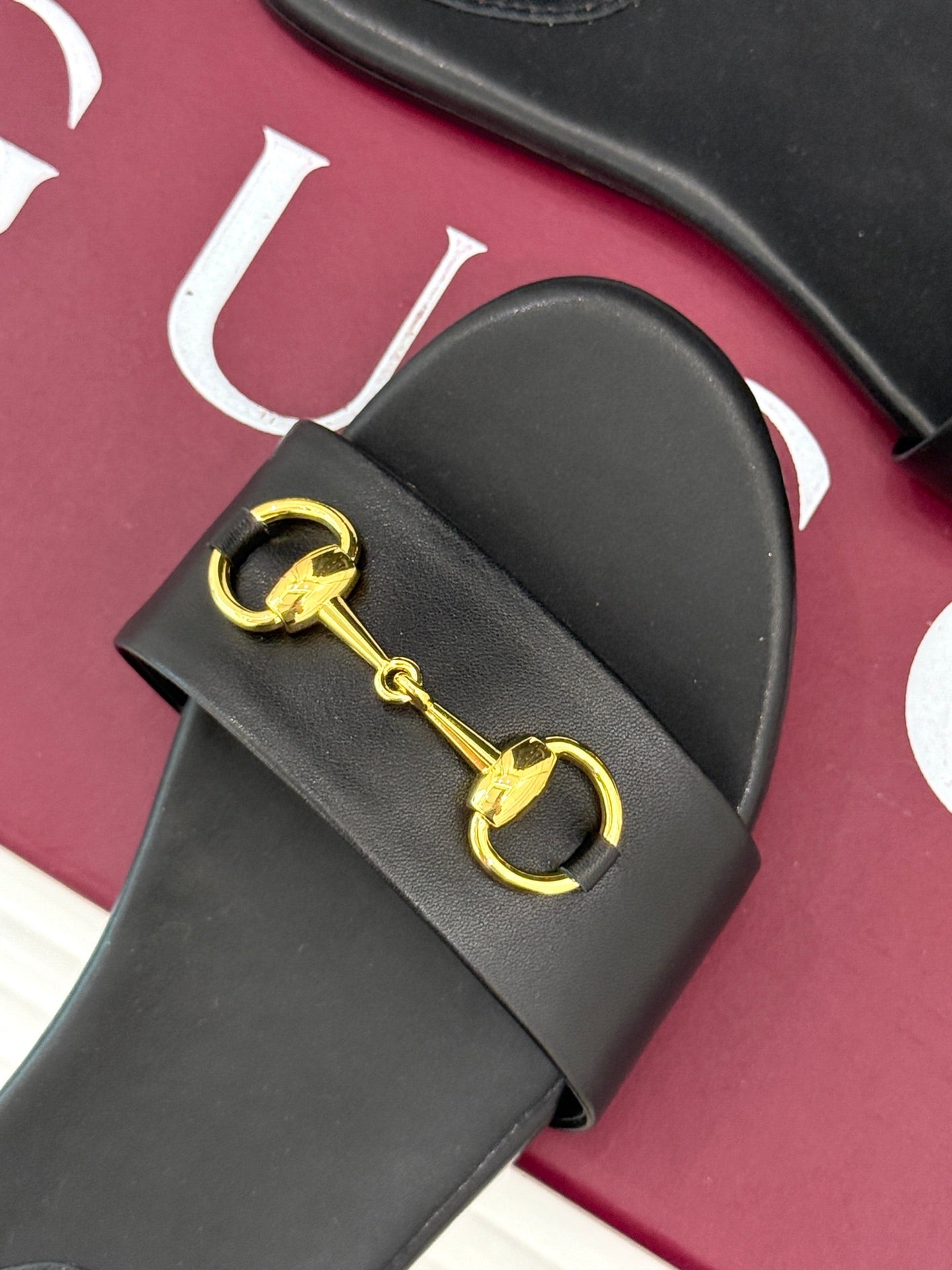 SLIDE SANDALS IN BLACK CALFSKIN WITH GOLD HARDWARE