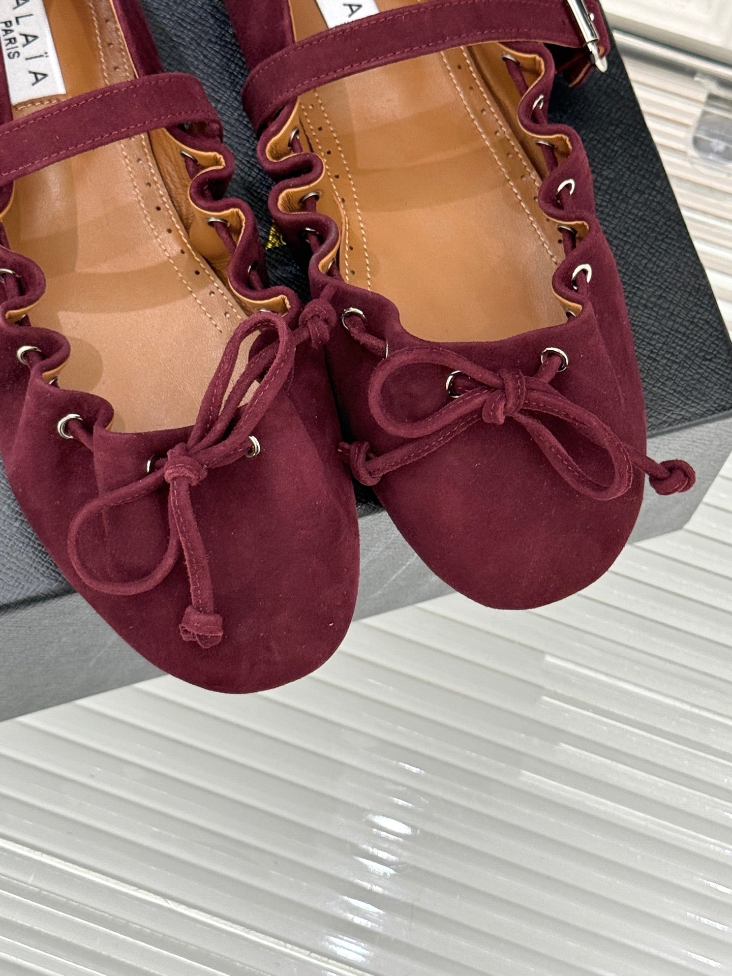 ALAIA 26S MARY JANE FLATS IN DARK RED SUEDE WITH BOW