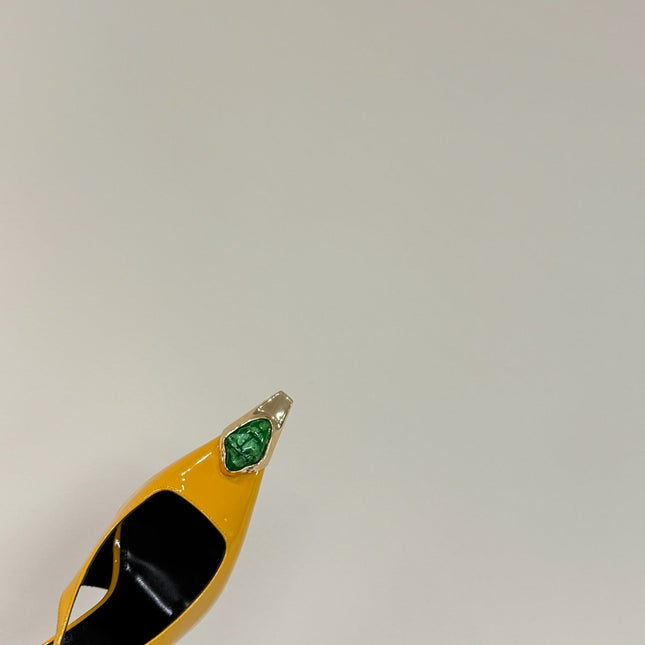 GREEN GEM-STUDDED SLINGBACK PUMPS IN YELLOW PATENT CALFSKIN