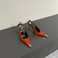 RED GEM-STUDDED SLINGBACK PUMPS IN ORANGE PATENT CALFSKIN