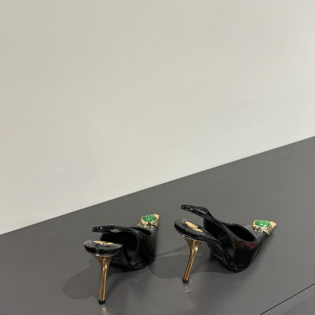 GREEN GEM-STUDDED SLINGBACK PUMPS IN BLACK PATENT CALFSKIN
