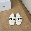 LOEWE 26S FLUFFY SLIDE SANDALS IN WHITE SHEARLING LOGO