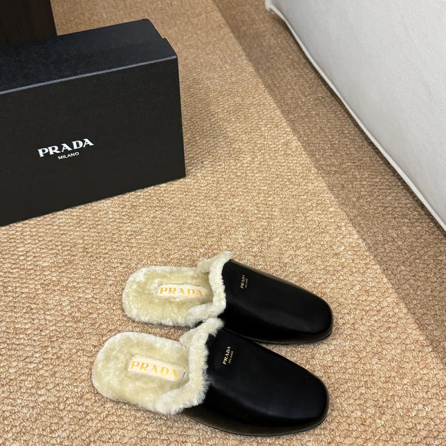 PRADA 26S SHEARLING MULE SLIPPERS IN BLACK CALFSKIN