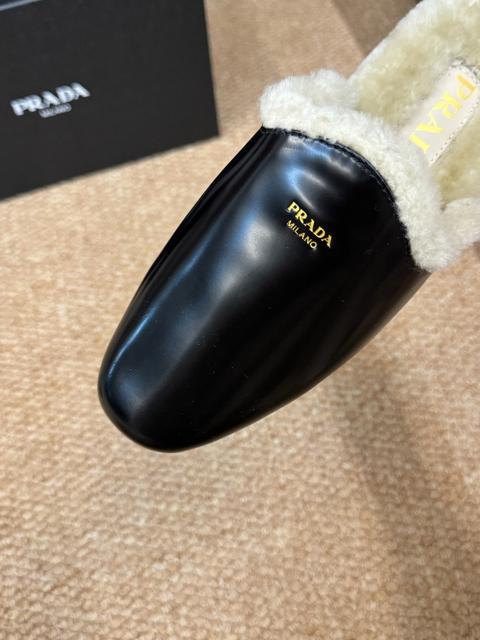 PRADA 26S SHEARLING MULE SLIPPERS IN BLACK CALFSKIN