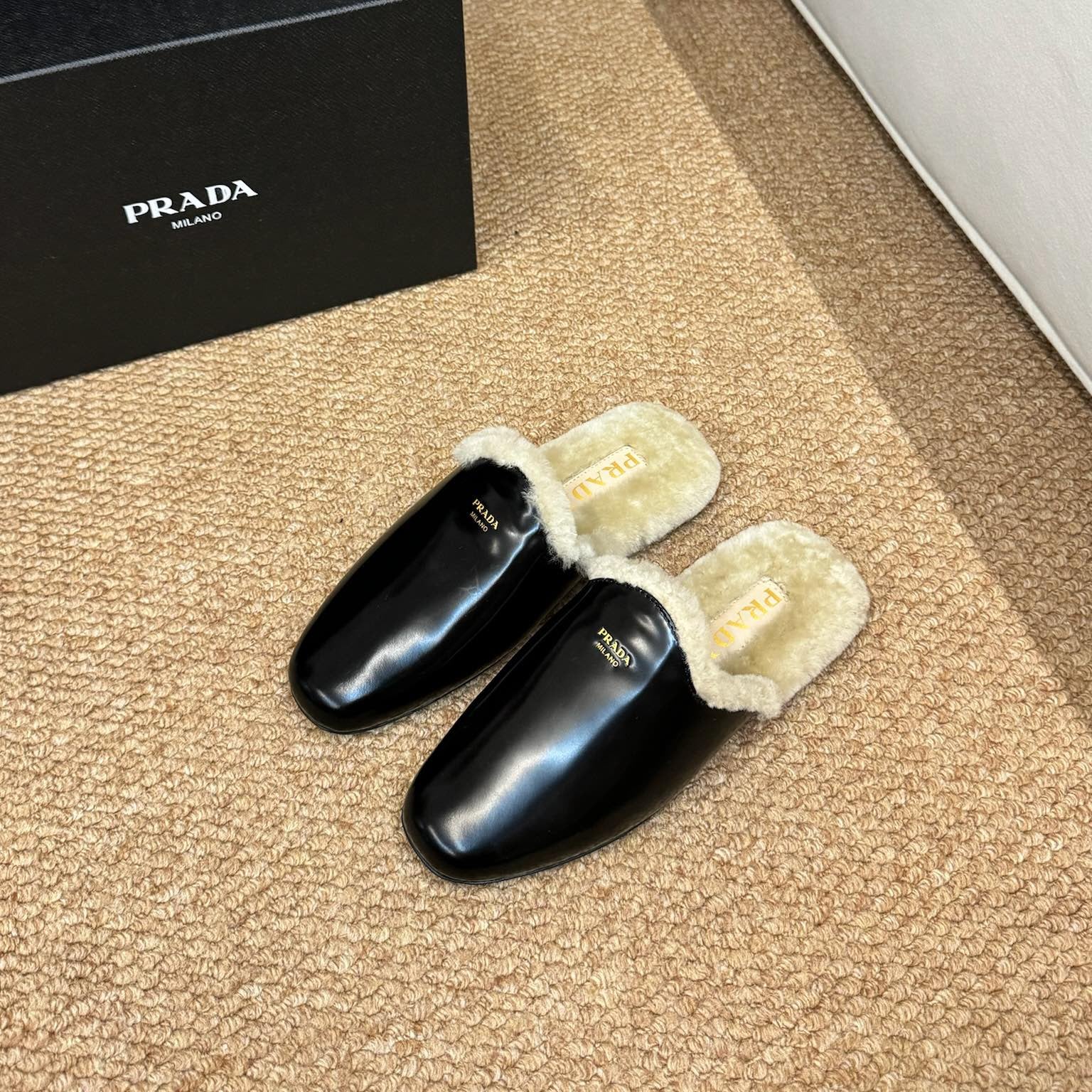 PRADA 26S SHEARLING MULE SLIPPERS IN BLACK CALFSKIN