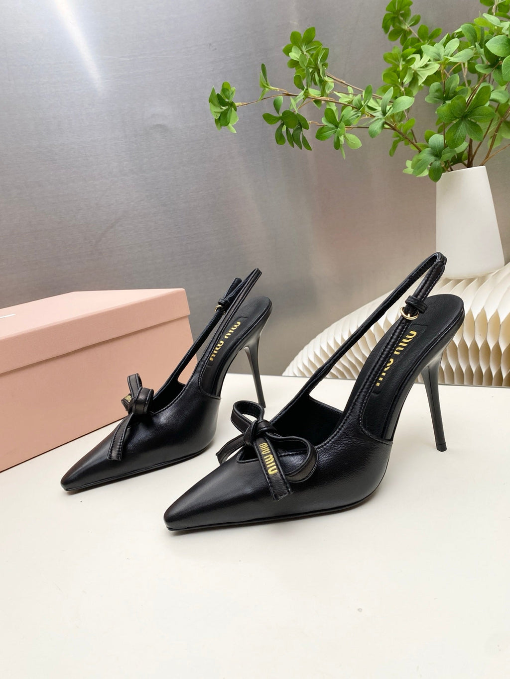 MIUMIU 26S SLINGBACK PUMPS 105MM IN BLACK CALFSKIN WITH BOW