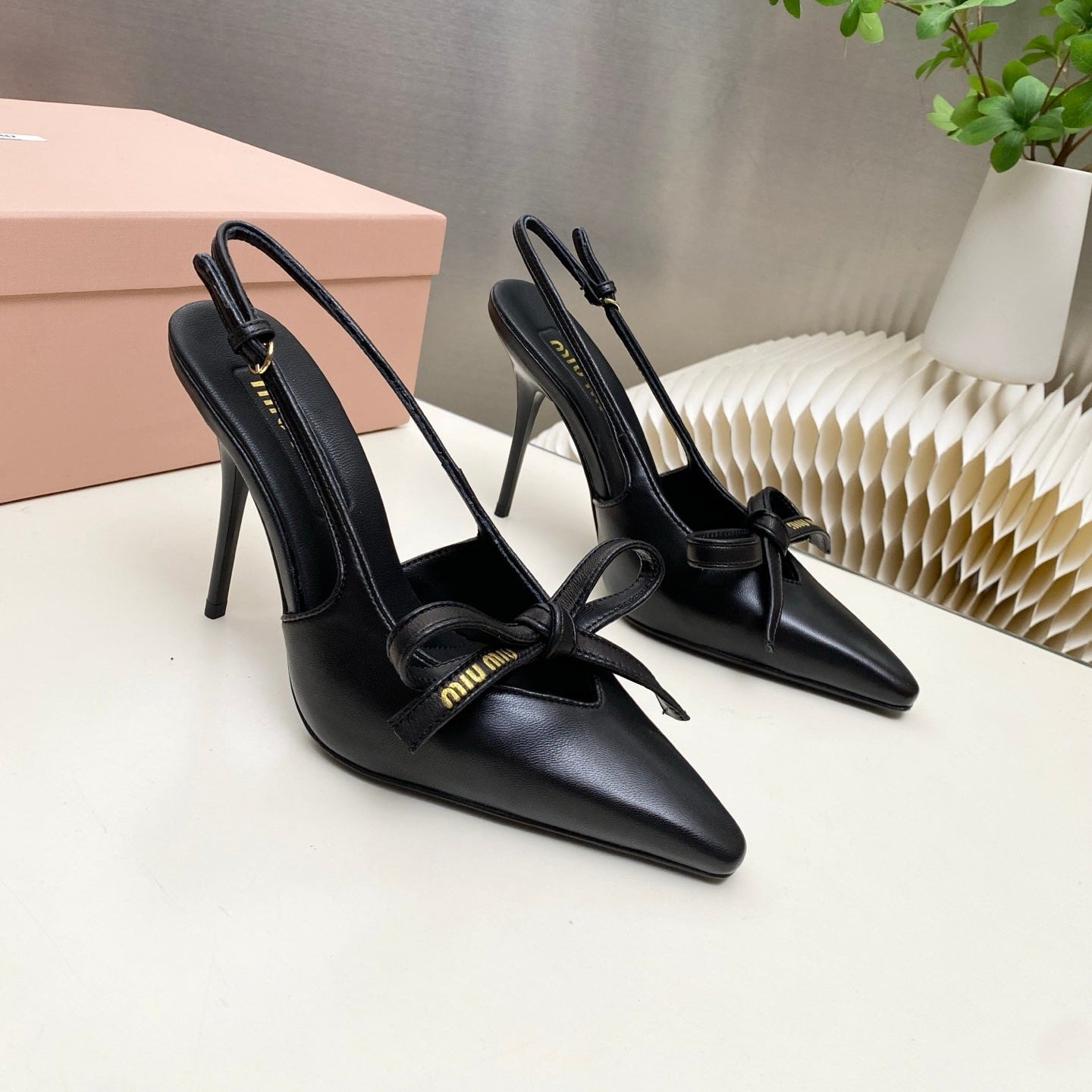 MIUMIU 26S SLINGBACK PUMPS 105MM IN BLACK CALFSKIN WITH BOW