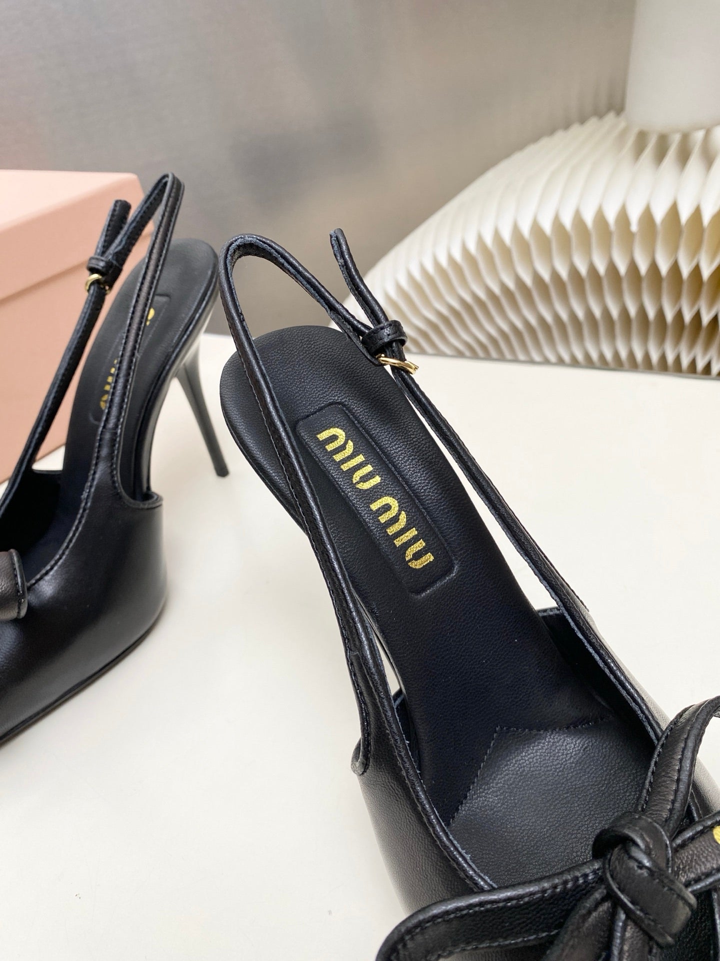 MIUMIU 26S SLINGBACK PUMPS 105MM IN BLACK CALFSKIN WITH BOW
