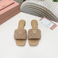 MIUMIU 26S MATELASSE SLIDES IN BEIGE CALFSKIN