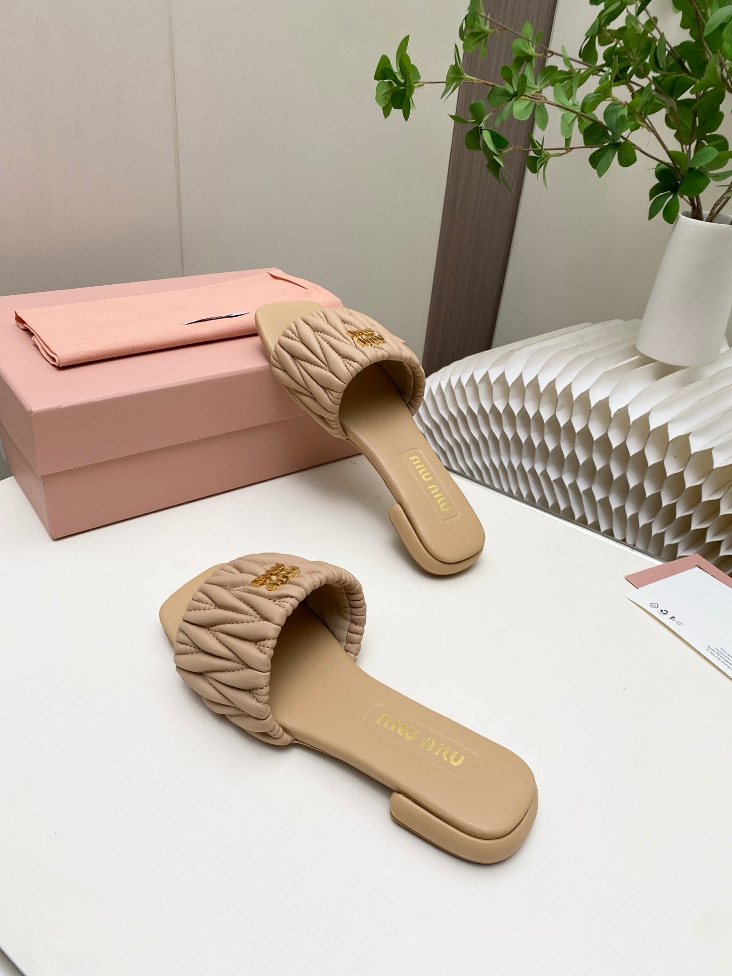 MIUMIU 26S MATELASSE SLIDES IN BEIGE CALFSKIN